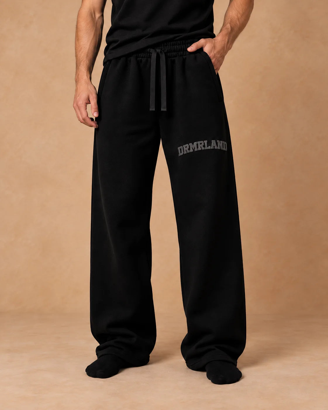 Black DREAM set: joggers, waist down, front
