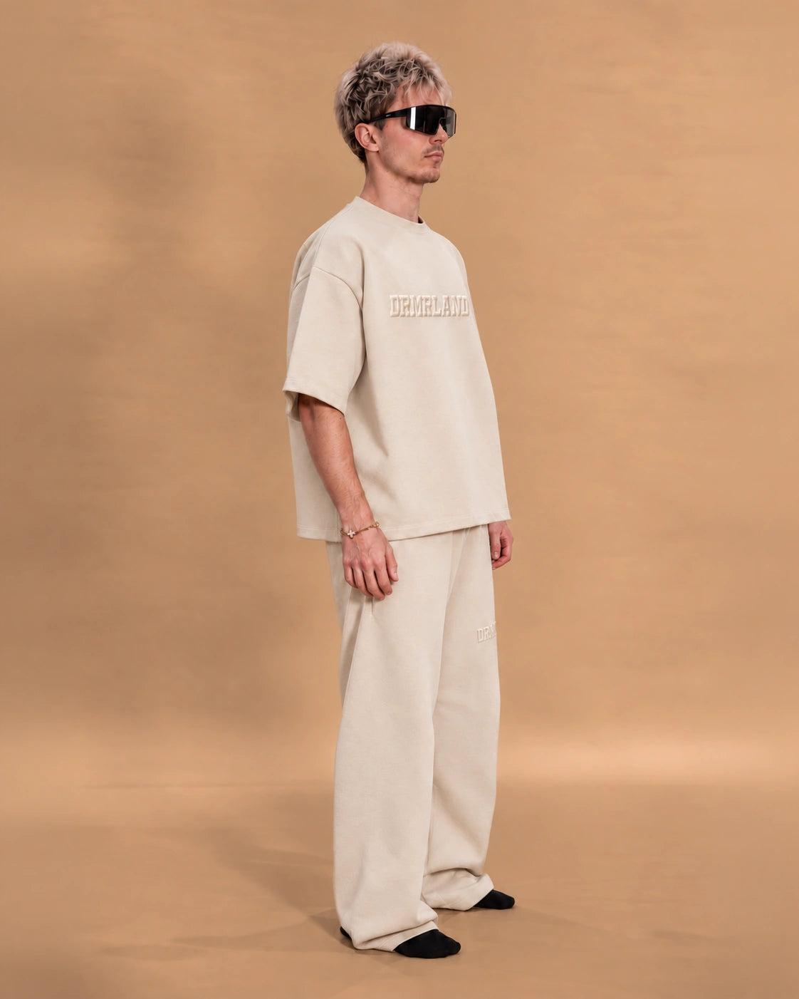 Man wearing the cream DREAM tee and jogger