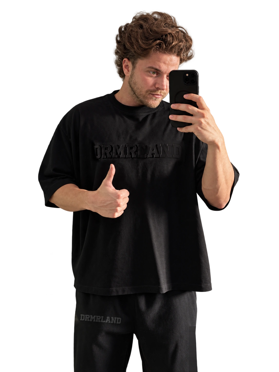 Cristian, founder of DRMRLAND, wearing the black DREAM set