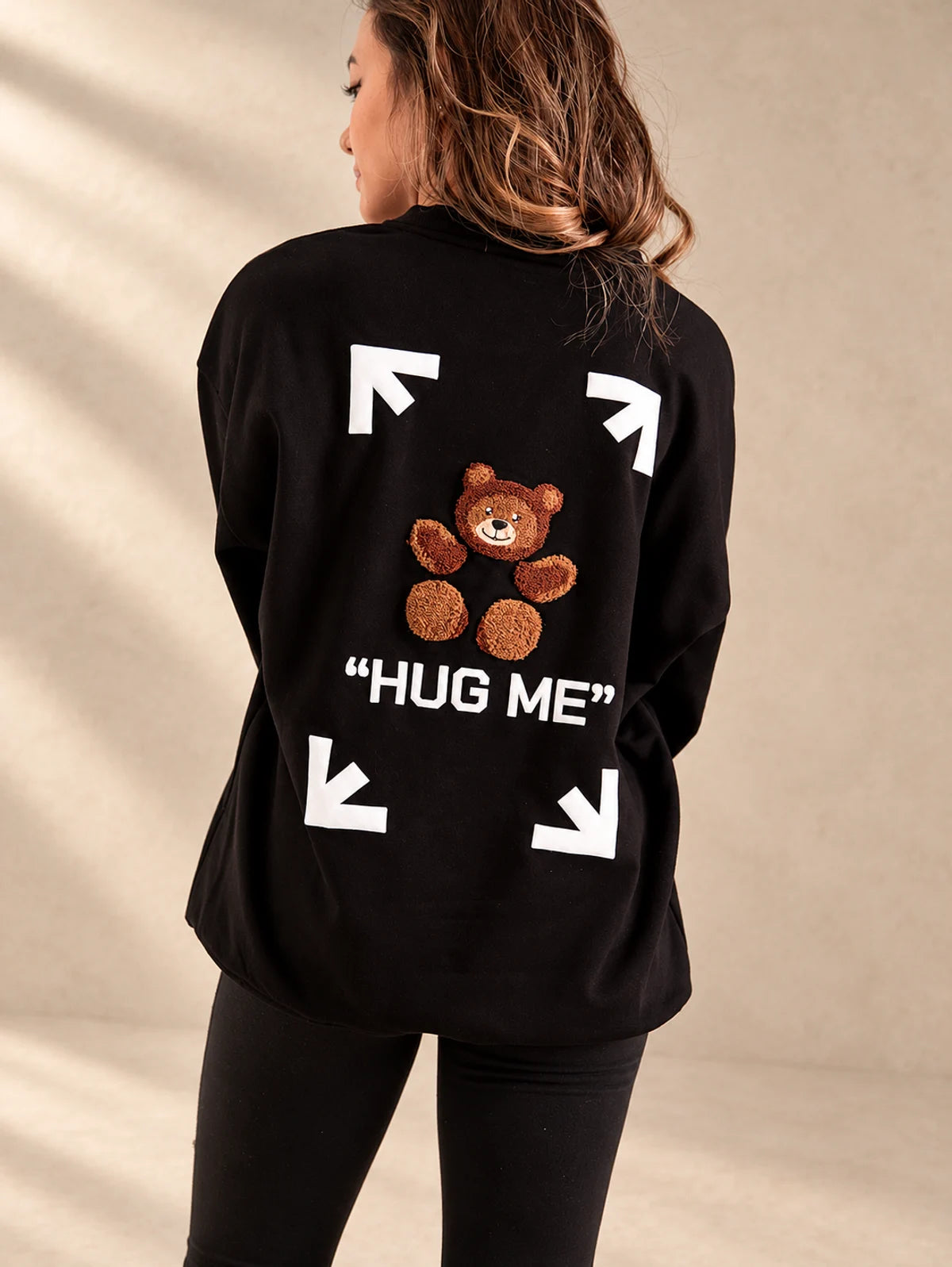 Hug Me sweater in black, back design