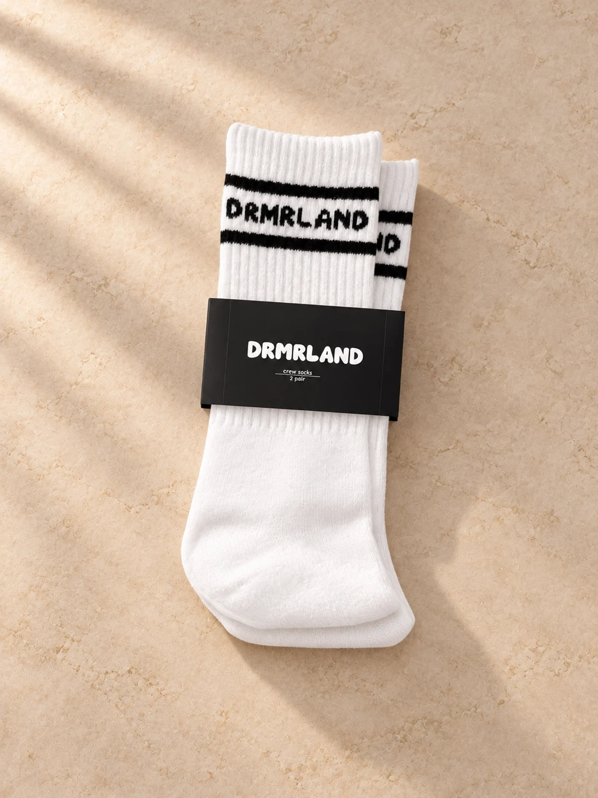 DRMRLAND crew socks in white, two-pair pack